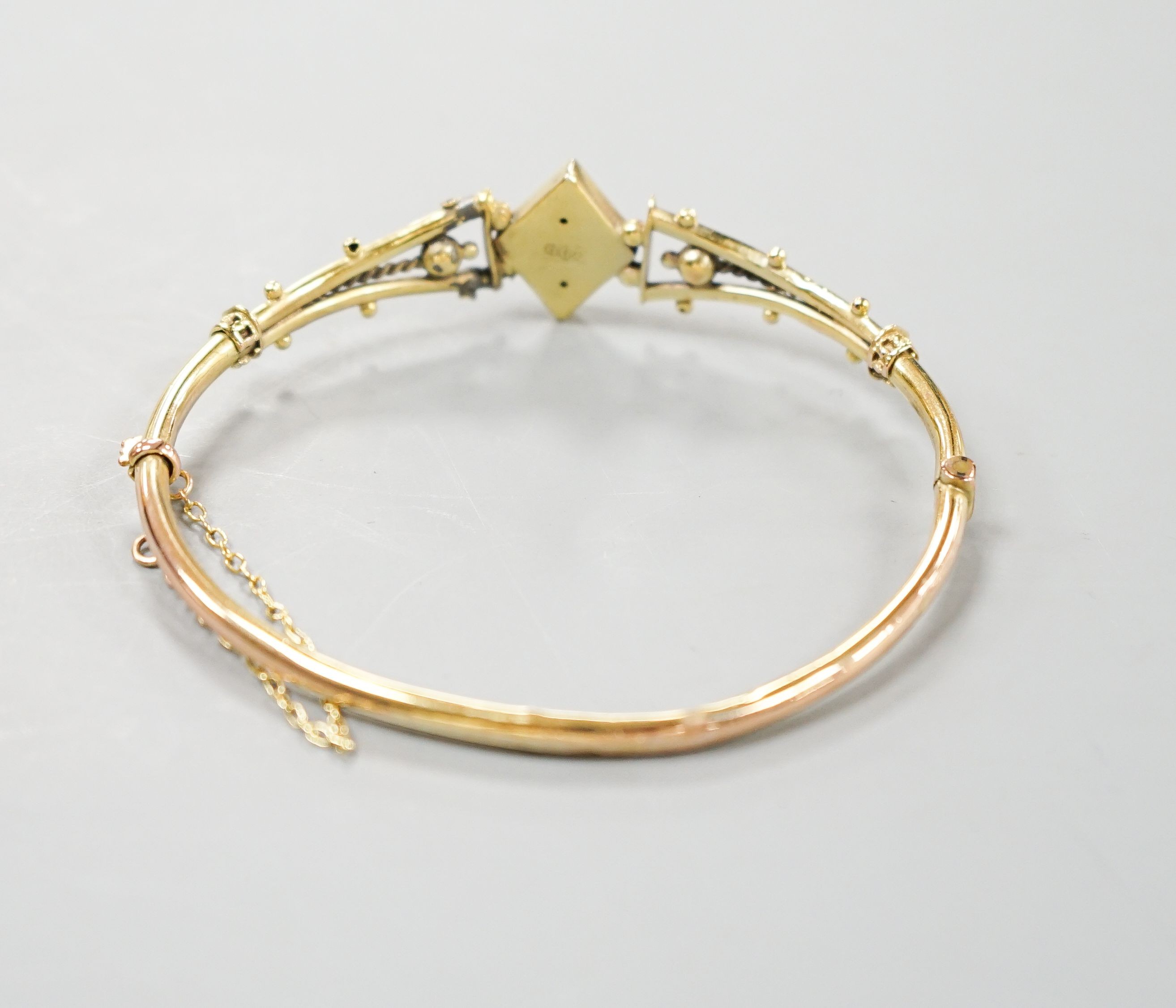 An Edwardian 9ct and gem set hinged bracelet (a.f.), gross weight 5.5 grams.